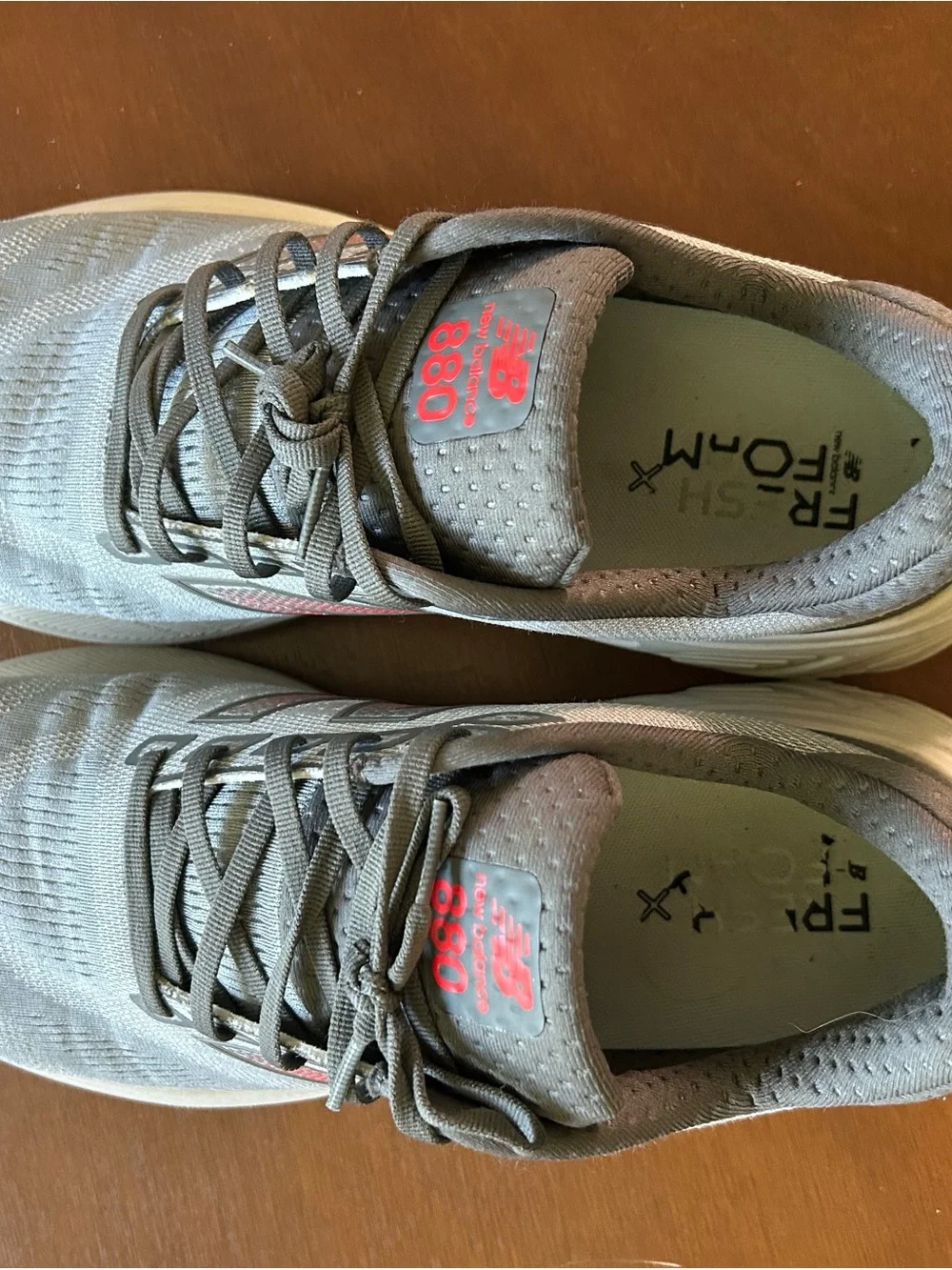 New Balance Gray Sneakers with Red Logo Accent